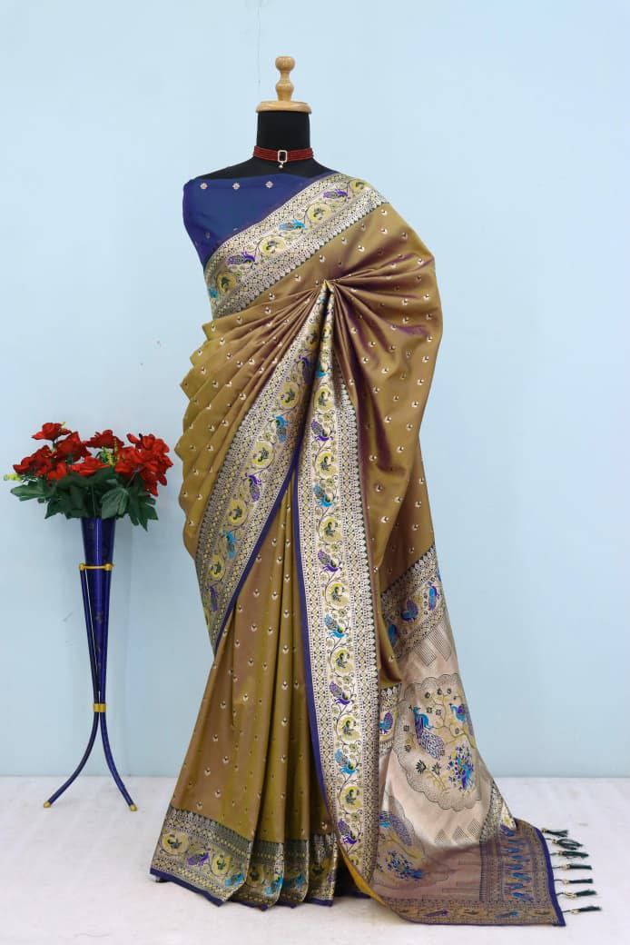 Has floral and peacock motifs on the zari border and pallu - BROWN