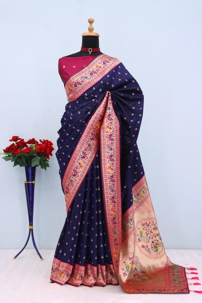 Has floral and peacock motifs on the zari border and pallu - NAVY BLUE
