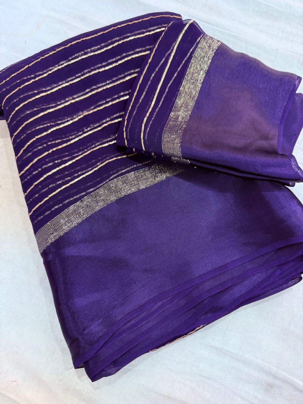 Elegant Purple  Viscose Georgette Saree with Satin Patti Border & Running Blouse